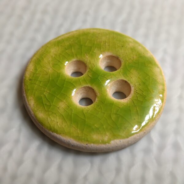 Zielony guzik ceramiczny