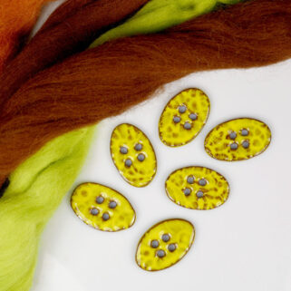 Guziki ceramiczne żółte owalne